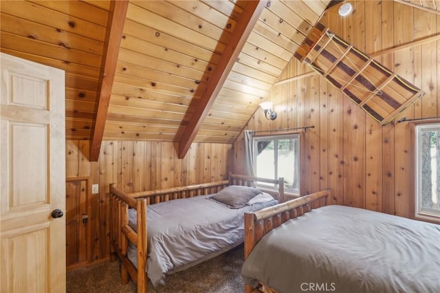 bedroom featuring lofted ceiling with beams, carpet, wood ceiling, and wooden walls