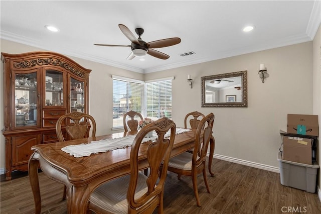 dining area featuring crown molding, wood finished floors, visible vents, and ceiling fan