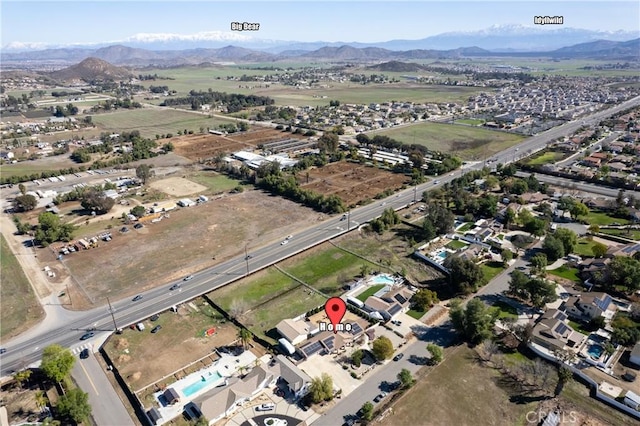 birds eye view of property featuring a mountain view