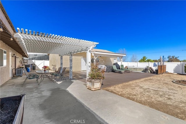 view of patio / terrace with central AC unit, outdoor dining area, a fenced backyard, and a pergola