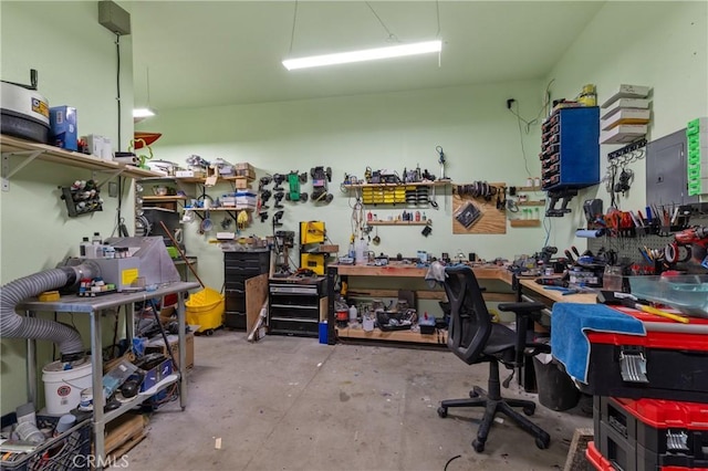 interior space featuring a workshop area and concrete floors