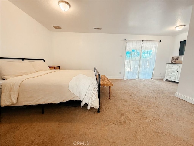 carpeted bedroom featuring access to outside, visible vents, and baseboards