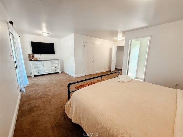 bedroom featuring carpet floors and baseboards