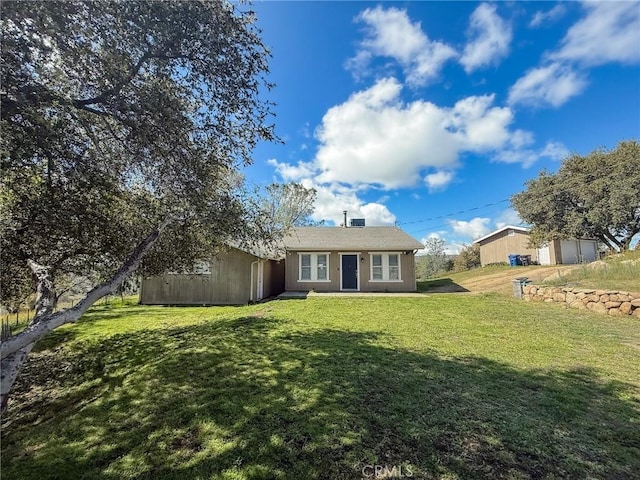 view of front of property with a garage and a front yard