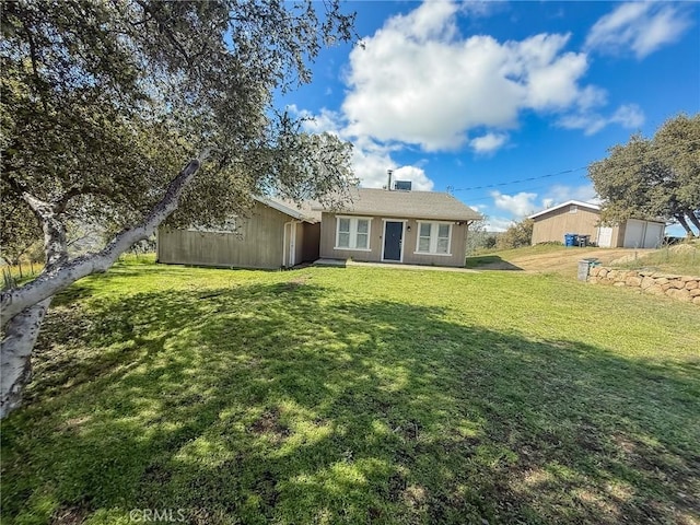 single story home with a front yard