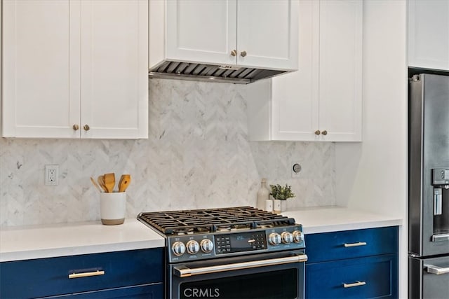 kitchen featuring light countertops, decorative backsplash, appliances with stainless steel finishes, white cabinetry, and blue cabinets