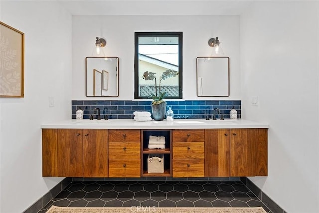 bathroom with double vanity, tasteful backsplash, and a sink