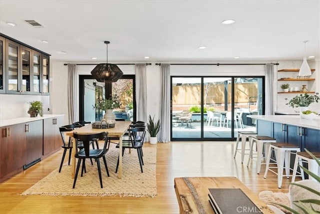 dining area featuring visible vents, recessed lighting, and light wood-type flooring