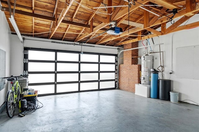 garage with gas water heater and a garage door opener