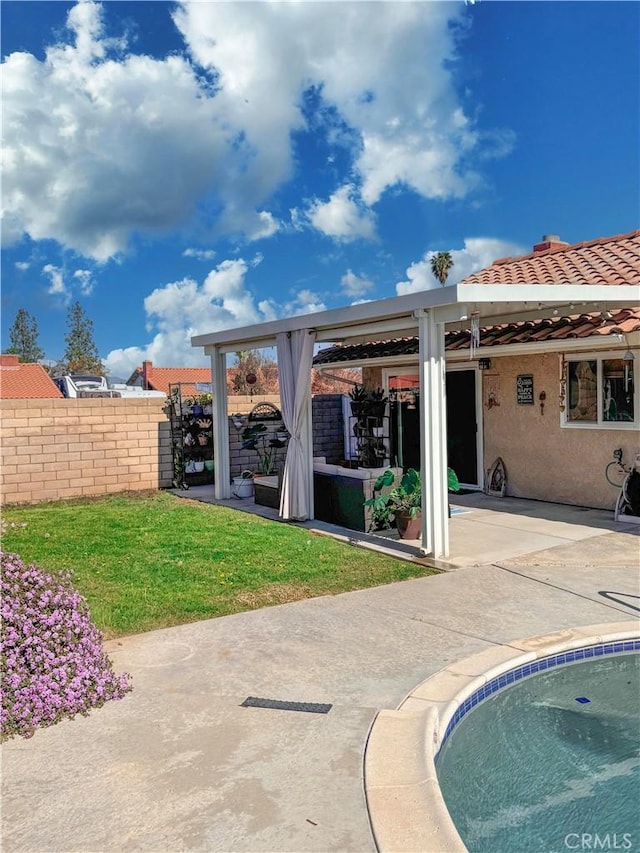 back of property featuring a patio area, fence, and stucco siding