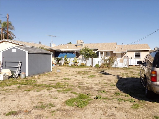 exterior space featuring an outdoor structure and a shed