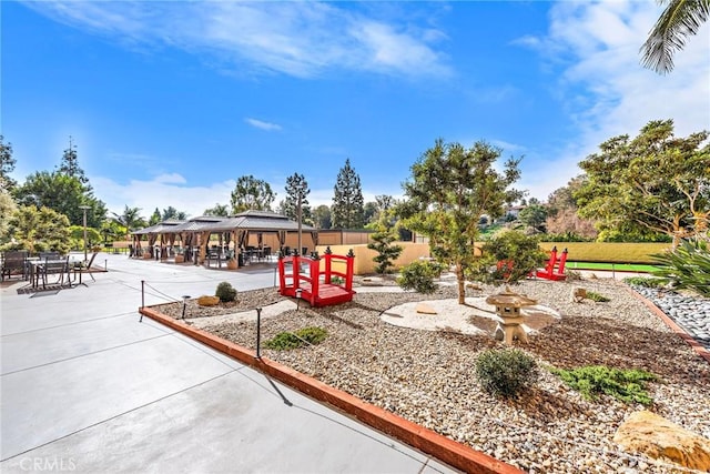 exterior space featuring a gazebo and a patio area