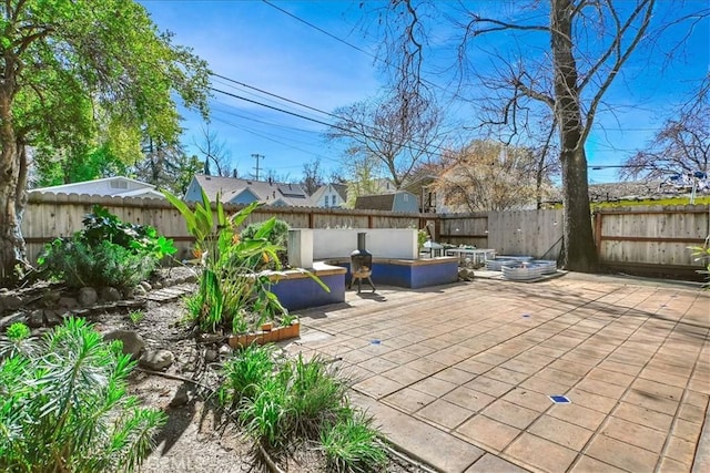 view of patio / terrace with an outdoor hangout area and a fenced backyard