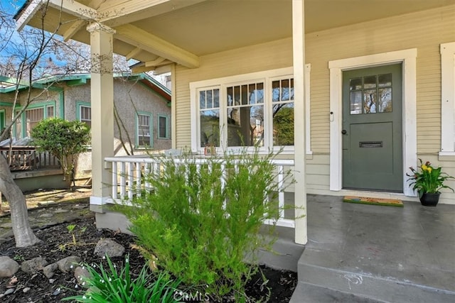 doorway to property with a porch