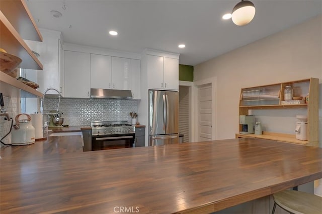 kitchen featuring recessed lighting, white cabinets, under cabinet range hood, appliances with stainless steel finishes, and backsplash