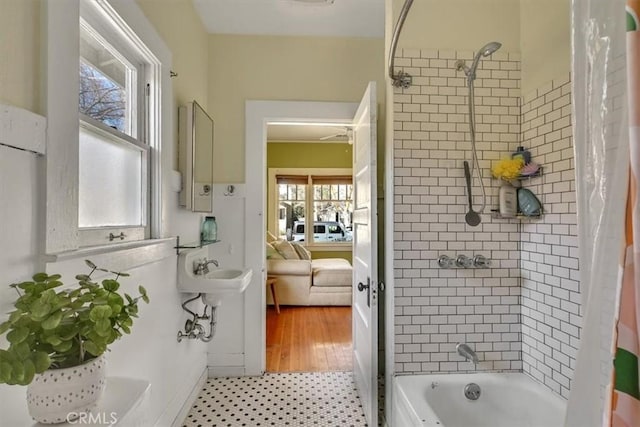 full bathroom with shower / tub combo