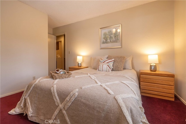 carpeted bedroom with baseboards