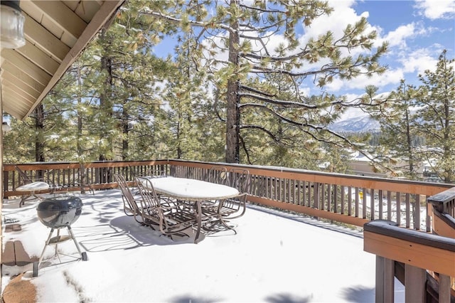 wooden deck with outdoor dining space