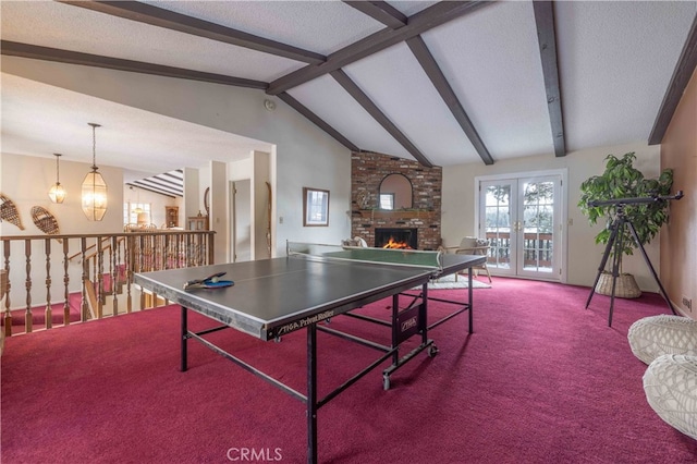 playroom with carpet floors, french doors, lofted ceiling with beams, and a textured ceiling