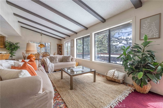 sunroom / solarium featuring lofted ceiling with beams