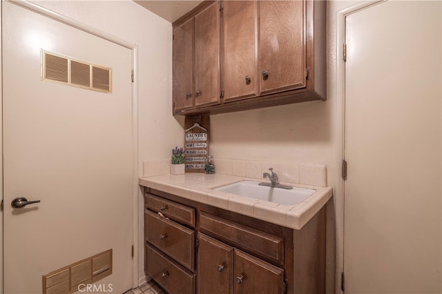 interior space featuring a sink and visible vents