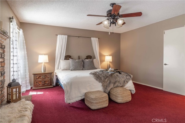 carpeted bedroom featuring ceiling fan and a textured ceiling