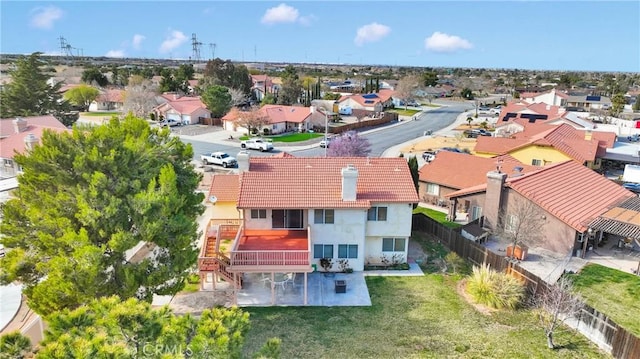 birds eye view of property with a residential view