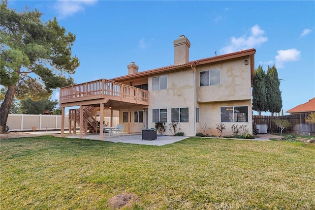 back of house with a patio, a fenced backyard, a chimney, a deck, and central air condition unit