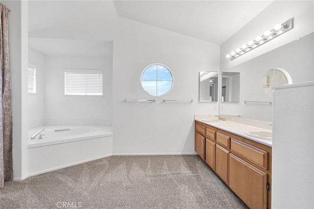 full bath featuring vaulted ceiling, carpet floors, double vanity, and a wealth of natural light