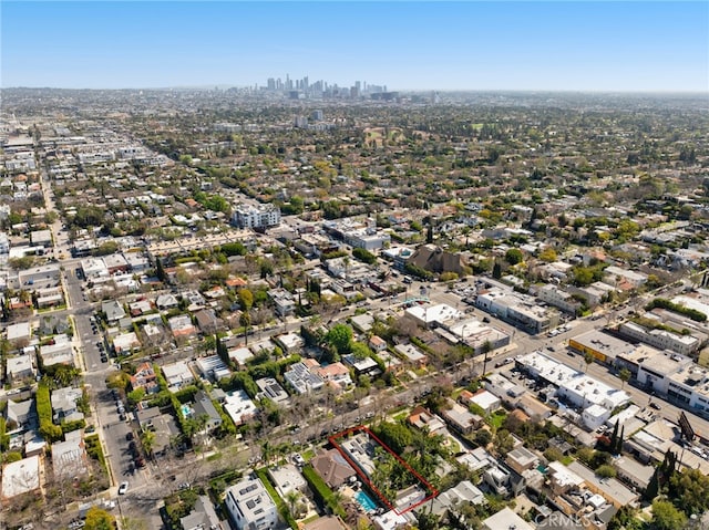 birds eye view of property with a view of city