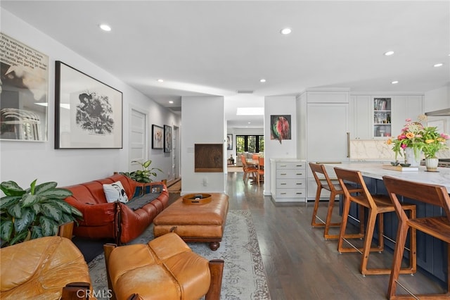 living area featuring dark wood finished floors, recessed lighting, and visible vents