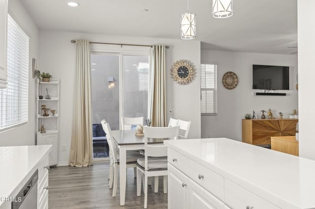 dining space featuring light wood finished floors and recessed lighting