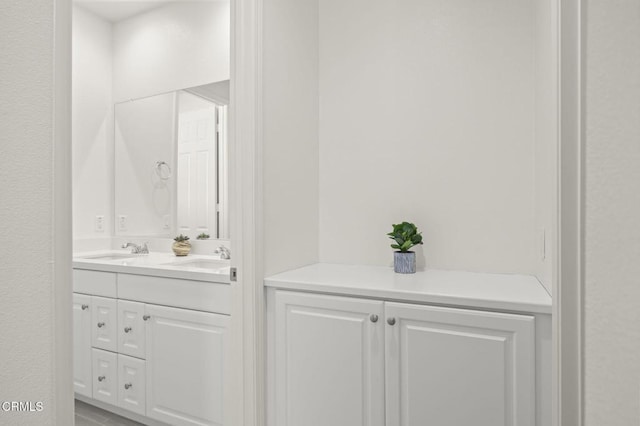 bathroom with double vanity and a sink