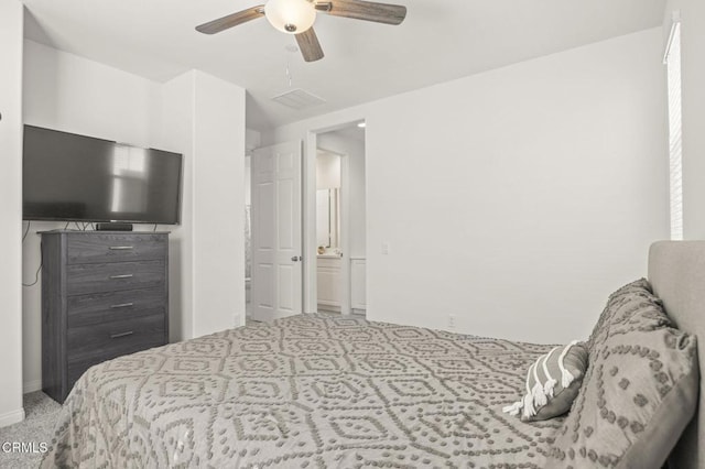 carpeted bedroom with a ceiling fan