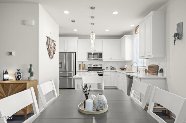 dining space featuring recessed lighting and visible vents
