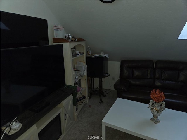 living room featuring light carpet and vaulted ceiling