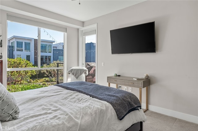 bedroom featuring carpet floors and baseboards