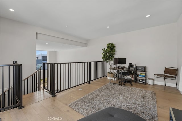 home office with wood finished floors and recessed lighting