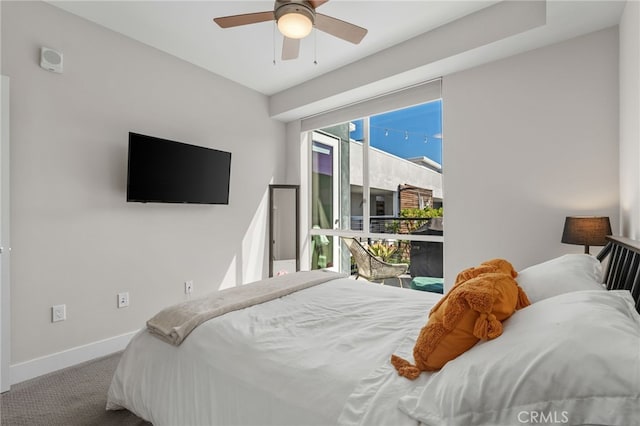 bedroom featuring a ceiling fan, carpet flooring, and baseboards