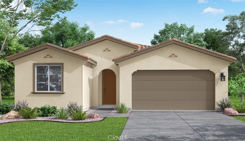 mediterranean / spanish-style home featuring driveway, an attached garage, a tiled roof, and stucco siding