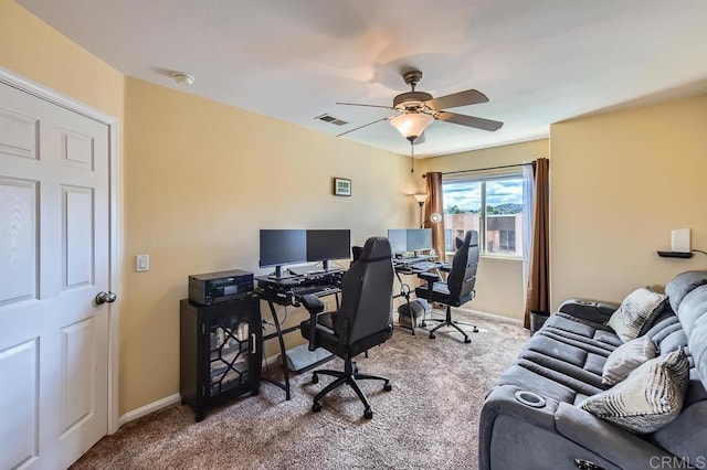 office area with baseboards, carpet floors, visible vents, and a ceiling fan