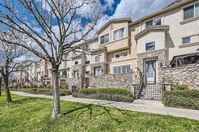 view of property with a residential view and fence