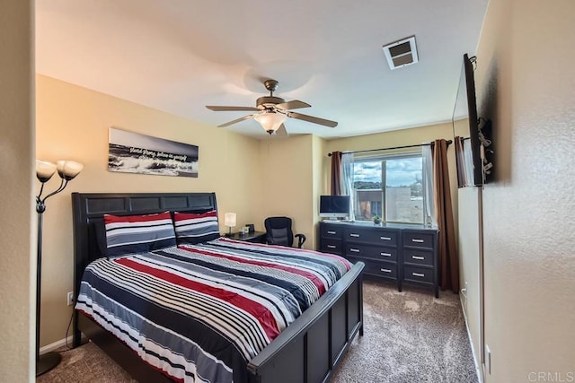 carpeted bedroom with baseboards, visible vents, and ceiling fan