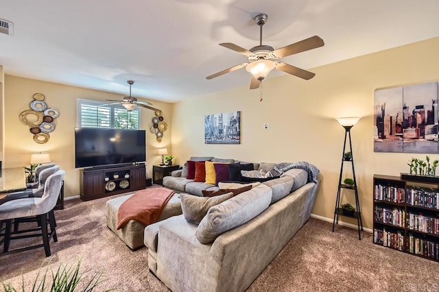 living area featuring a ceiling fan, visible vents, baseboards, and carpet flooring