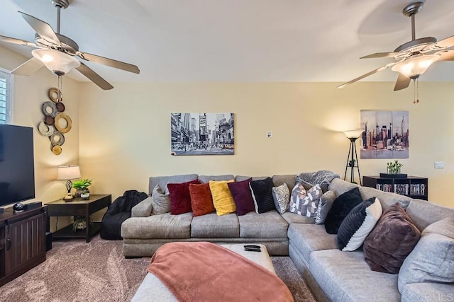 living area featuring carpet flooring and ceiling fan