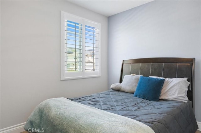 bedroom featuring baseboards