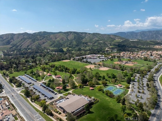 birds eye view of property with a mountain view