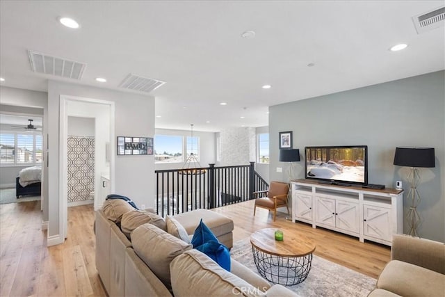 living room with a wealth of natural light and visible vents