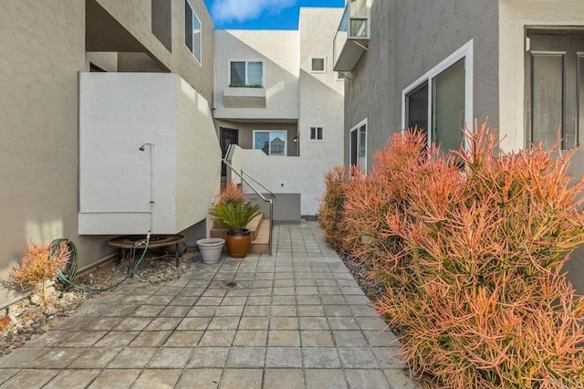 view of property's community featuring a patio area