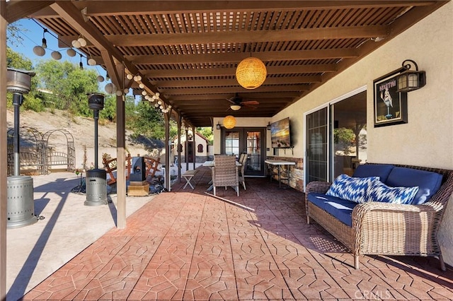 view of patio with a ceiling fan, outdoor lounge area, a pergola, and french doors